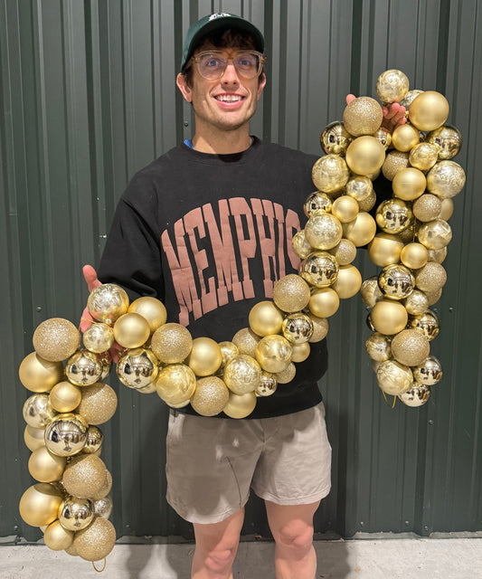 Champagne colored Clustered ball garland 6 feet long assorted between glitter Matte, shiny and feathered ornaments.