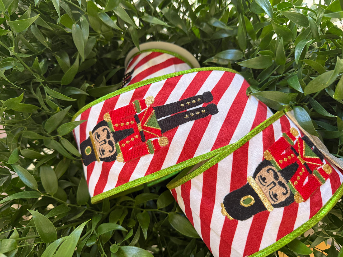 JME heavy wired ribbon. RED/WHITE Stripes with Embroidered Nutcracker 4"x 10YDS