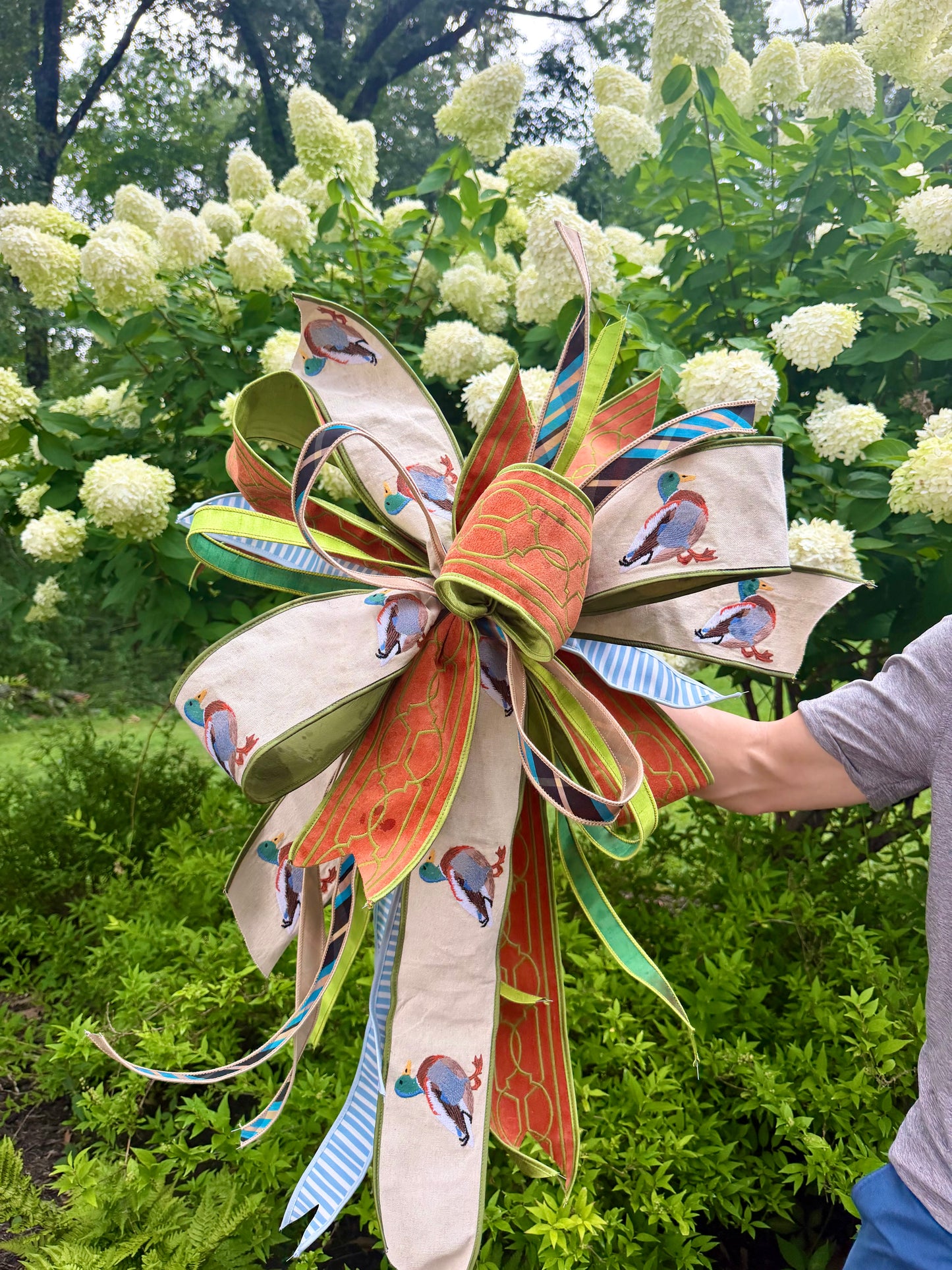Summer time JME hand tied bow with embroidered ducks! About 3 feet long by 23 inches wide. Some fluffing may be required upon receiving.