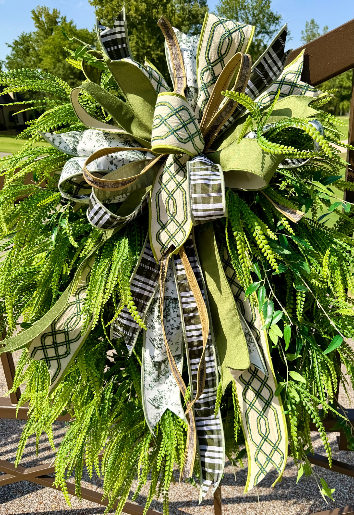 Green/neutral themed bow. Hand tied JME bow. Bow ONLY greenery not included *some fluffing may be required upon receiving.