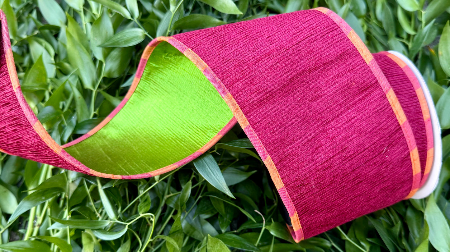 JME heavy wired ribbon. Red Apple Chenille with orange and coral piping with a green metallic back. 4“ x 10 yards.