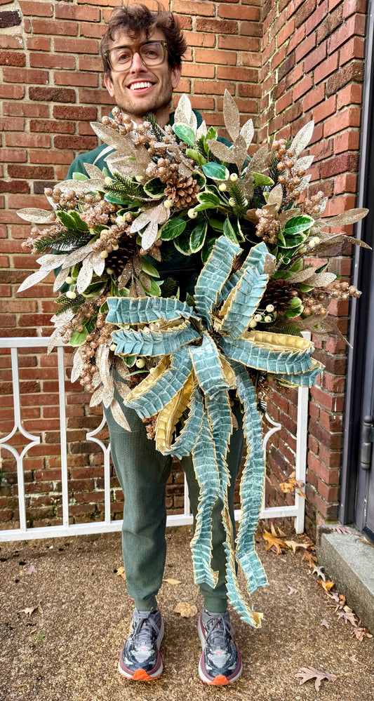 Winter blues wreath. Handmade by JME paired with a JME handtied ruffle bow. About 24inches wide.