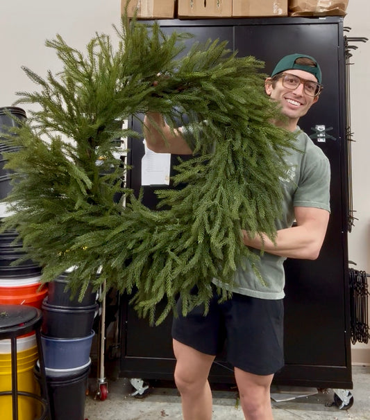 42 inch faux Northfolk Pine wreath. Very realistic feeling. Great for indoor or outdoor. 