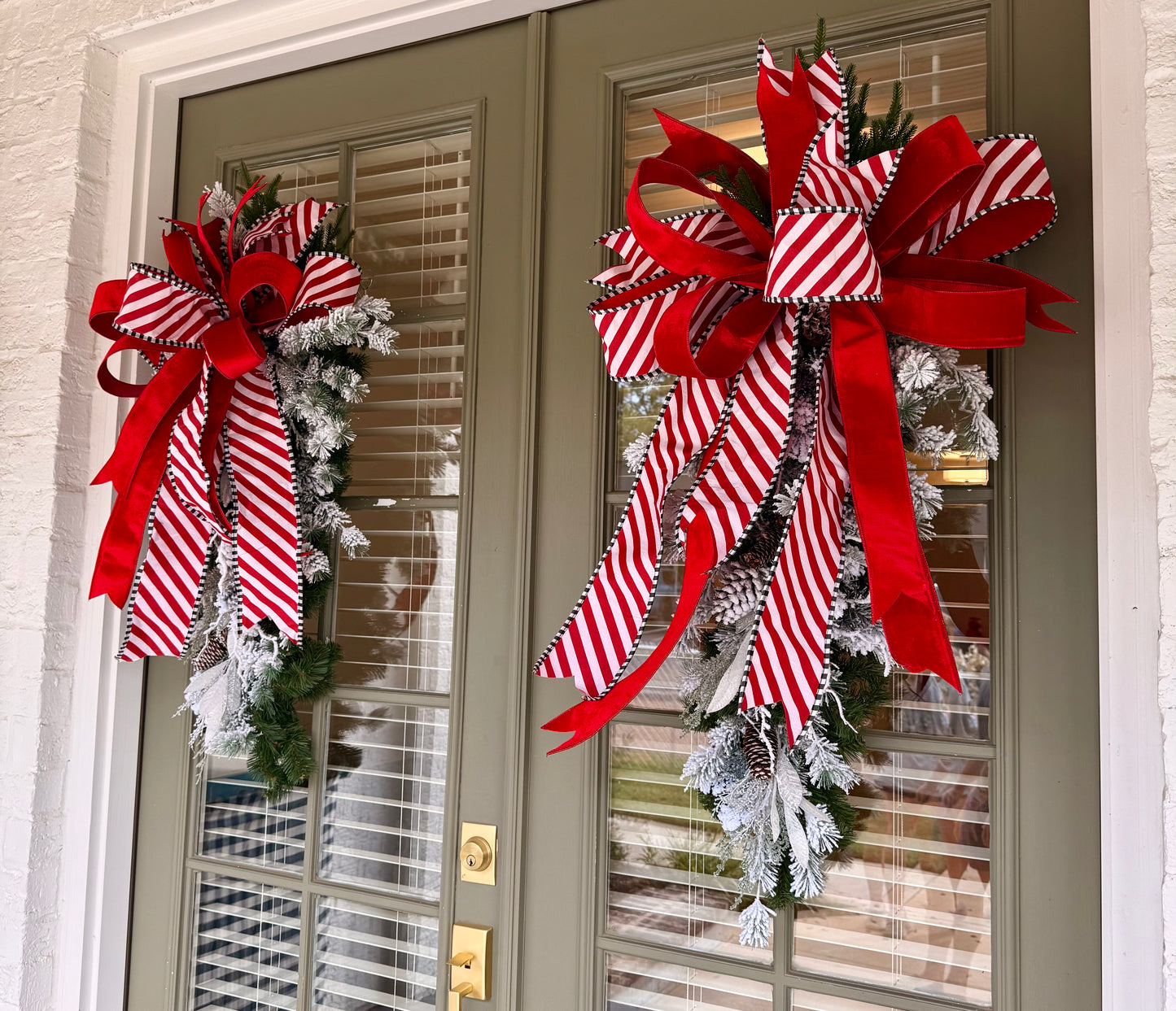 Candy Cain inspired door swag. Flocked and paired with a JME hand-tied bow.