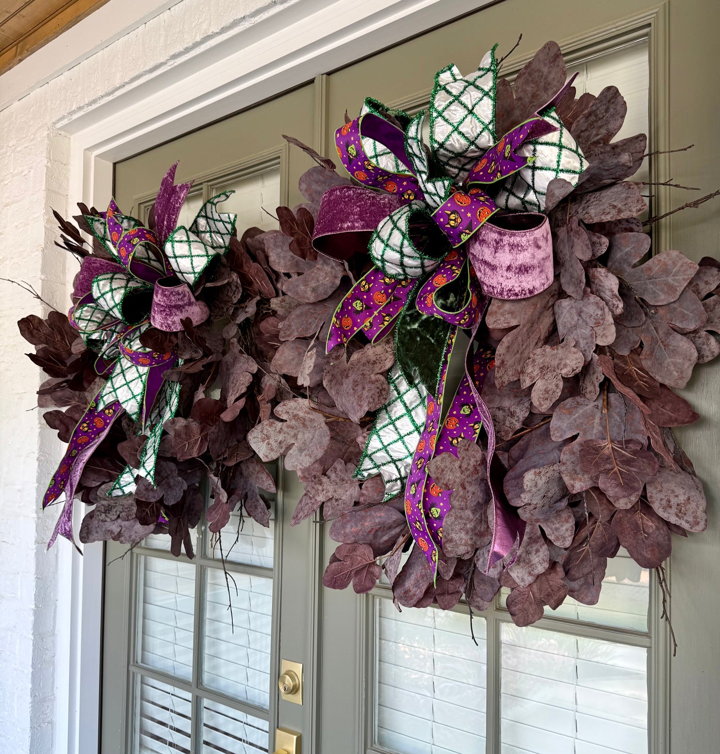 Faux Purple Leaf wreath , with hand tied JME Halloween bow. About 32 inches wide.