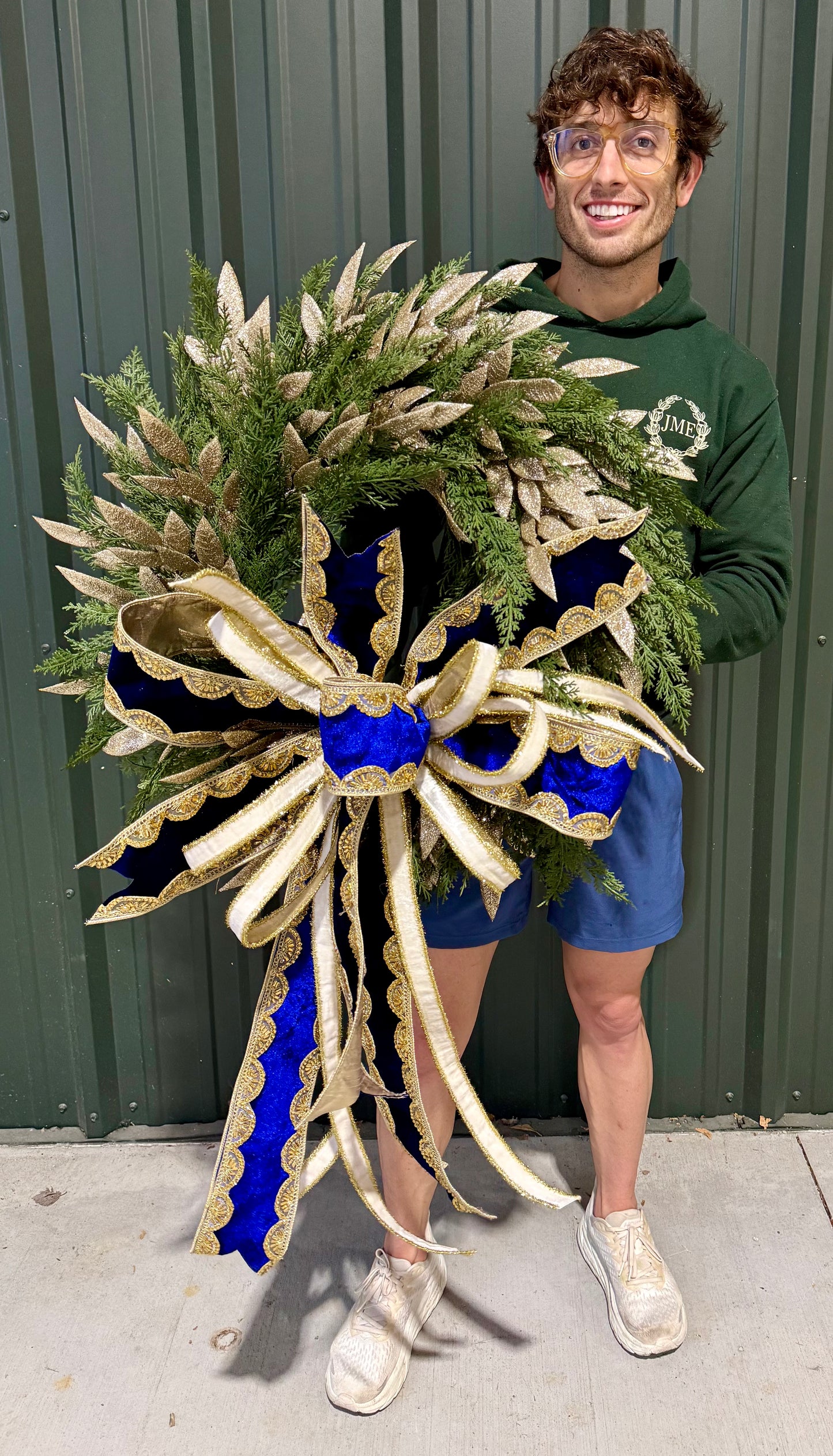 Lux faux winter wreath. With a lush JME handtied blue and white velvet bow. Perfect for all winter long.