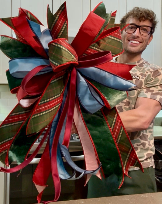 Hand tied JME bow. Traditional plaid with blue ribbon!