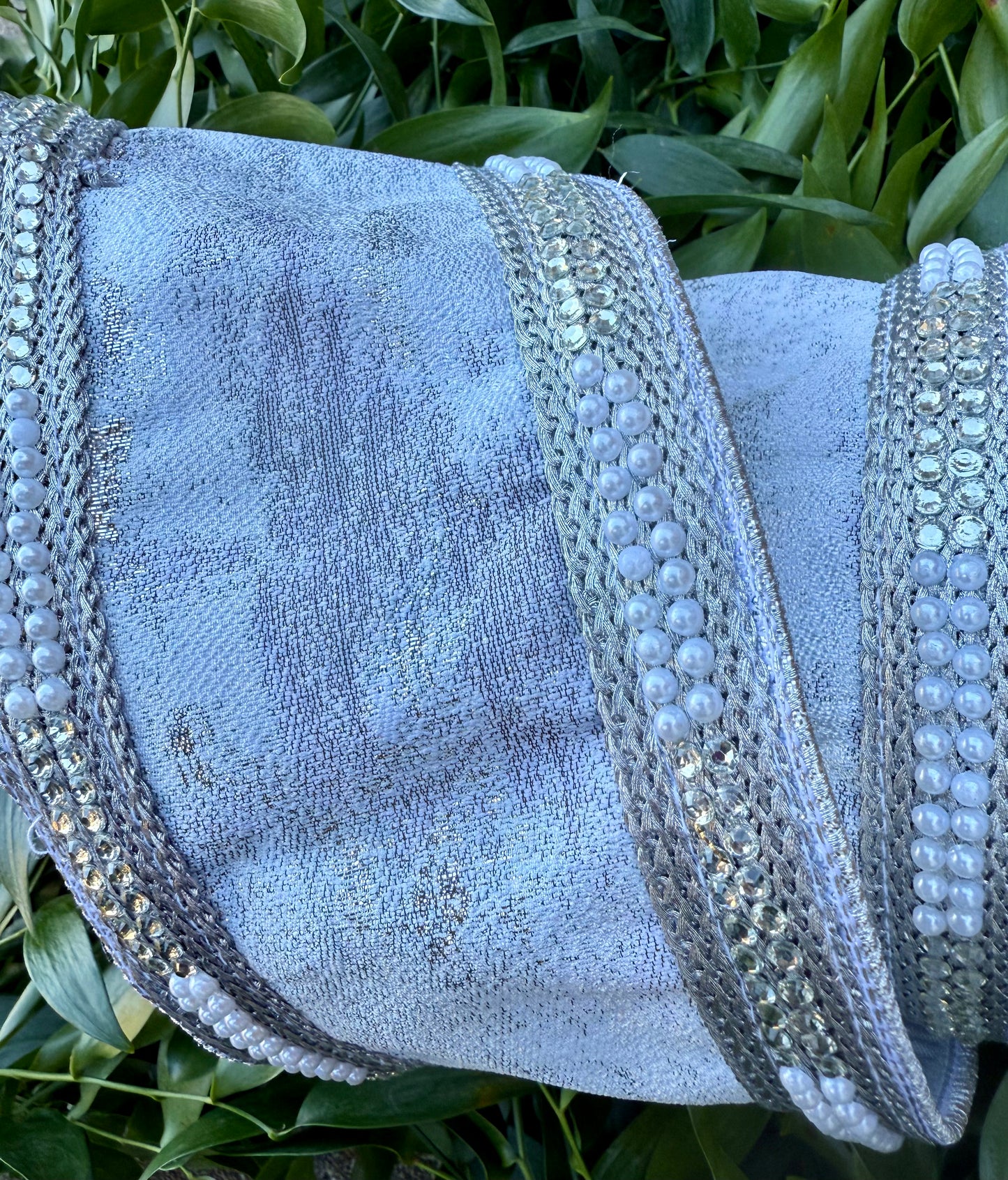 JME heavy wired ribbon. Silver/white bark design with pearl trim back with silver metallic ribbon. 4” x 5 yards.