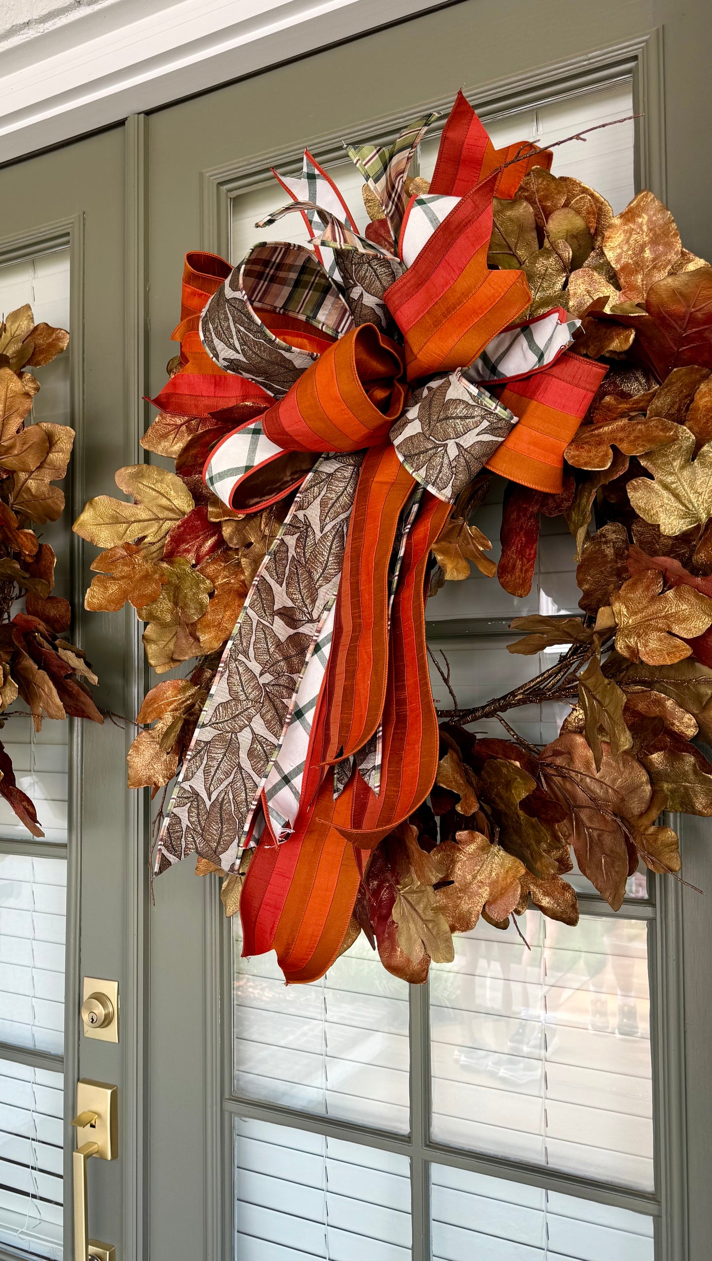 Faux fall leaf wreath with bronze brushing. 30inches wide. With a JME hand tied bow!