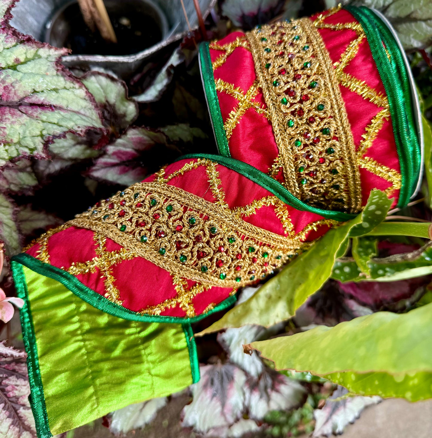 JME RED/GREEN jeweled band with gold tinsel and a metallic green backing. Heavy wired ribbon. 4” x 5 yards.