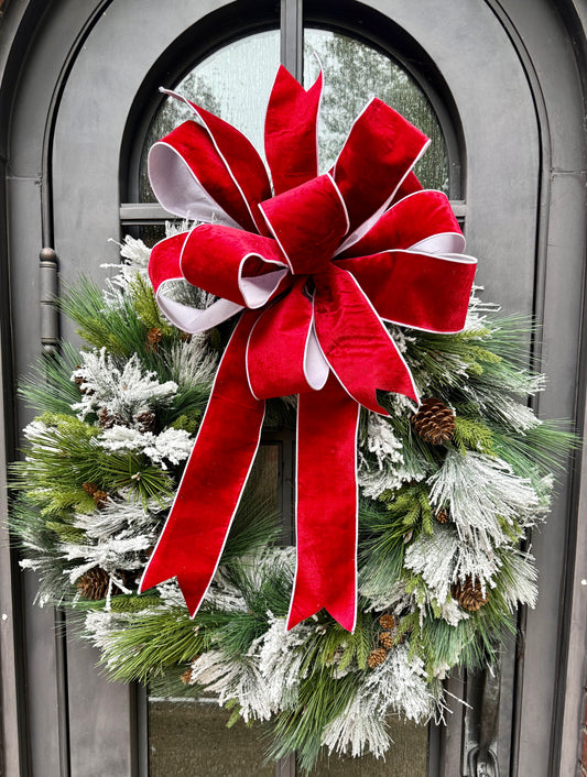 Big Flocked mixed foliage wreath with a JME hand tied bow in it. Red velvet backed with white taffeta. 36inches wide
