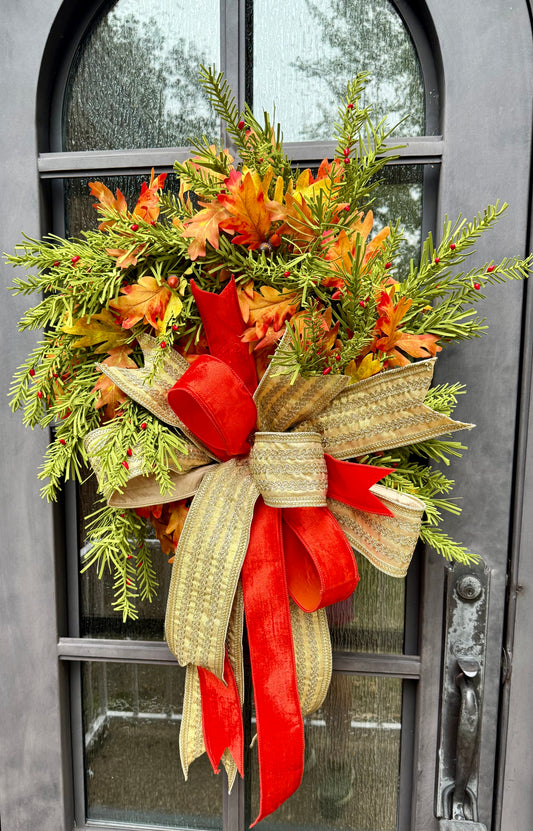 Glamorous fall wreath. Handmade wreath by JME paired with a beautiful JME hand tied bow of gold ribbon and orange velvet. About 24 inches wide.