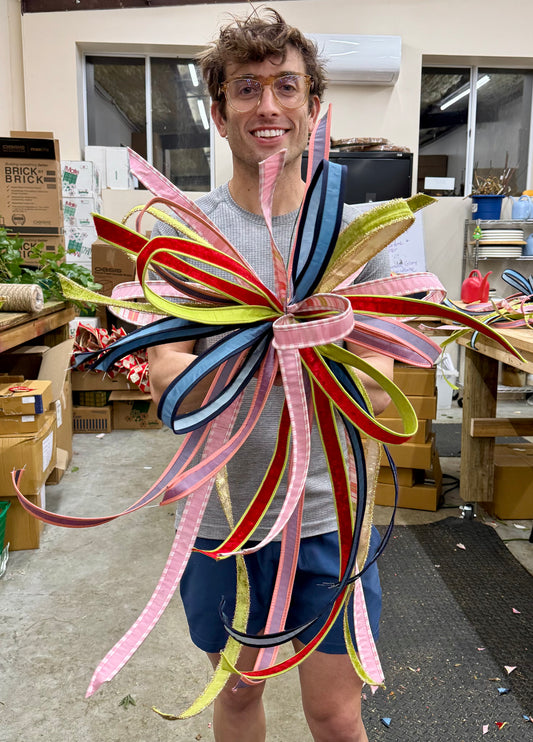 JME hand tied bow of 1inch ribbons. Multicolored bow.