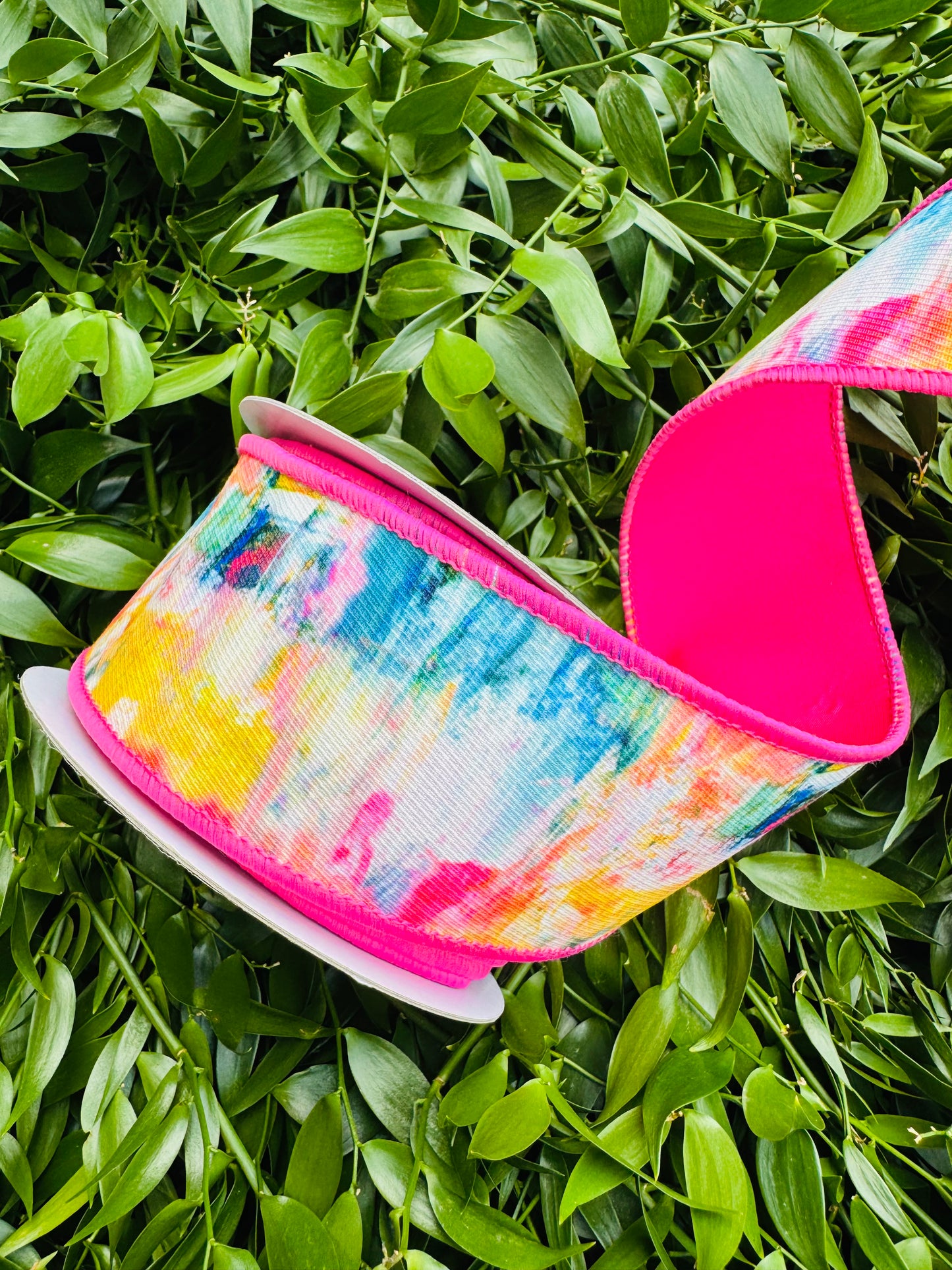 JME heavy wired ribbon. Multicolor Abstract with Hot Pink Taffeta Back 2.5"x 10YDS