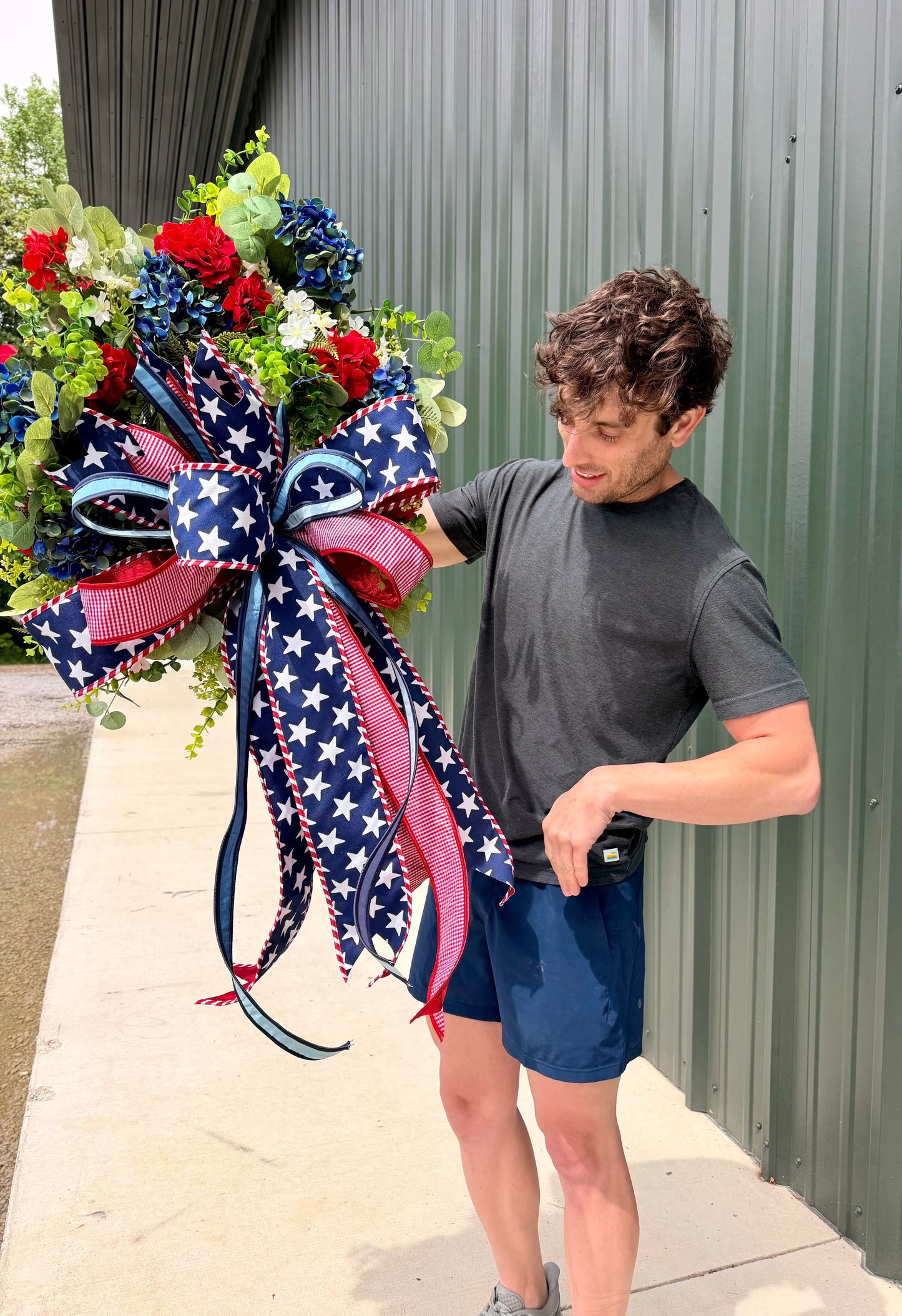 Handmade JME PATRIOTIC wreath. Paired with a JME hand tied bow of MIXED ribbons and a 4in star ribbon. About 24inches in diameter.