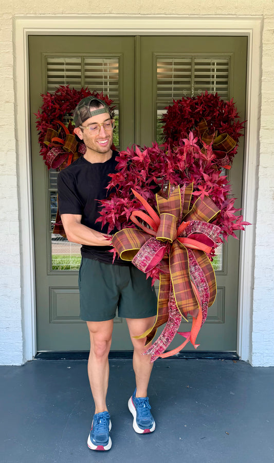 Red maple leaf wreath. Paired with a JME hand tied plaid fall bow. About 24 inches in diameter. * some fluffing may be required upon receiving.