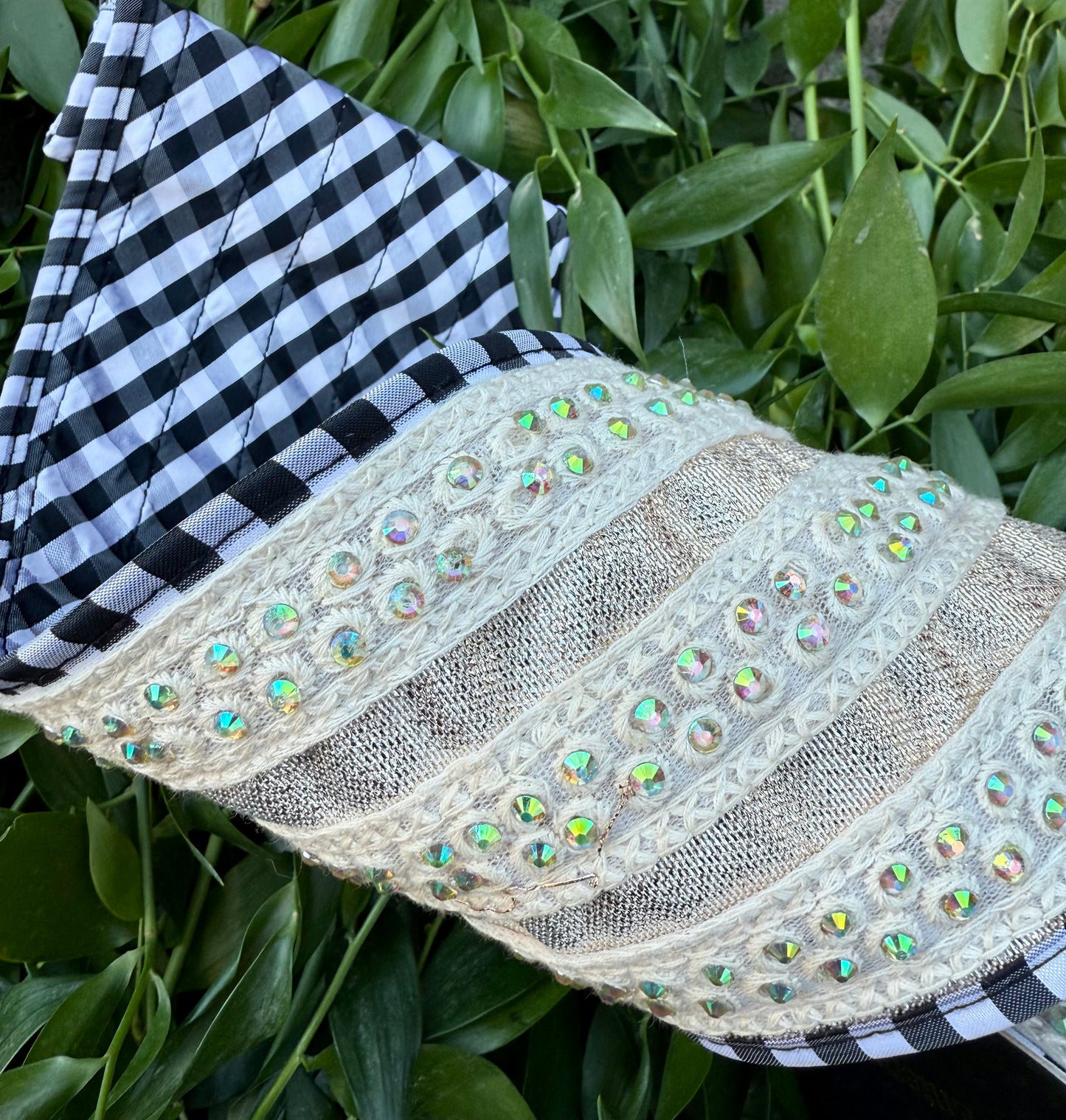 JME heavy wired ribbon. Metallic ribbon with jewel, cream, bands, and black and white piping. Backed with black and white diagonal checked. 4” x 5 yards.