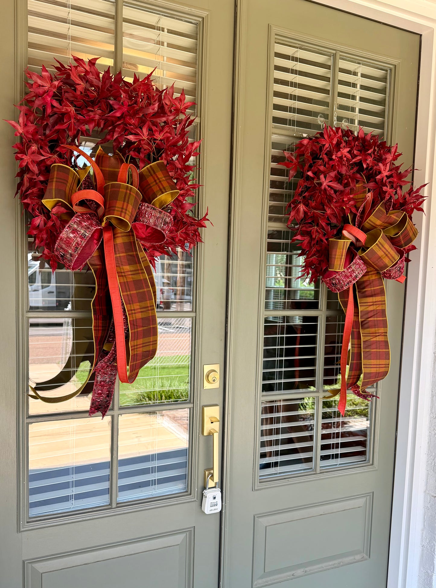 Red maple leaf wreath. Paired with a JME hand tied plaid fall bow. About 24 inches in diameter. * some fluffing may be required upon receiving.