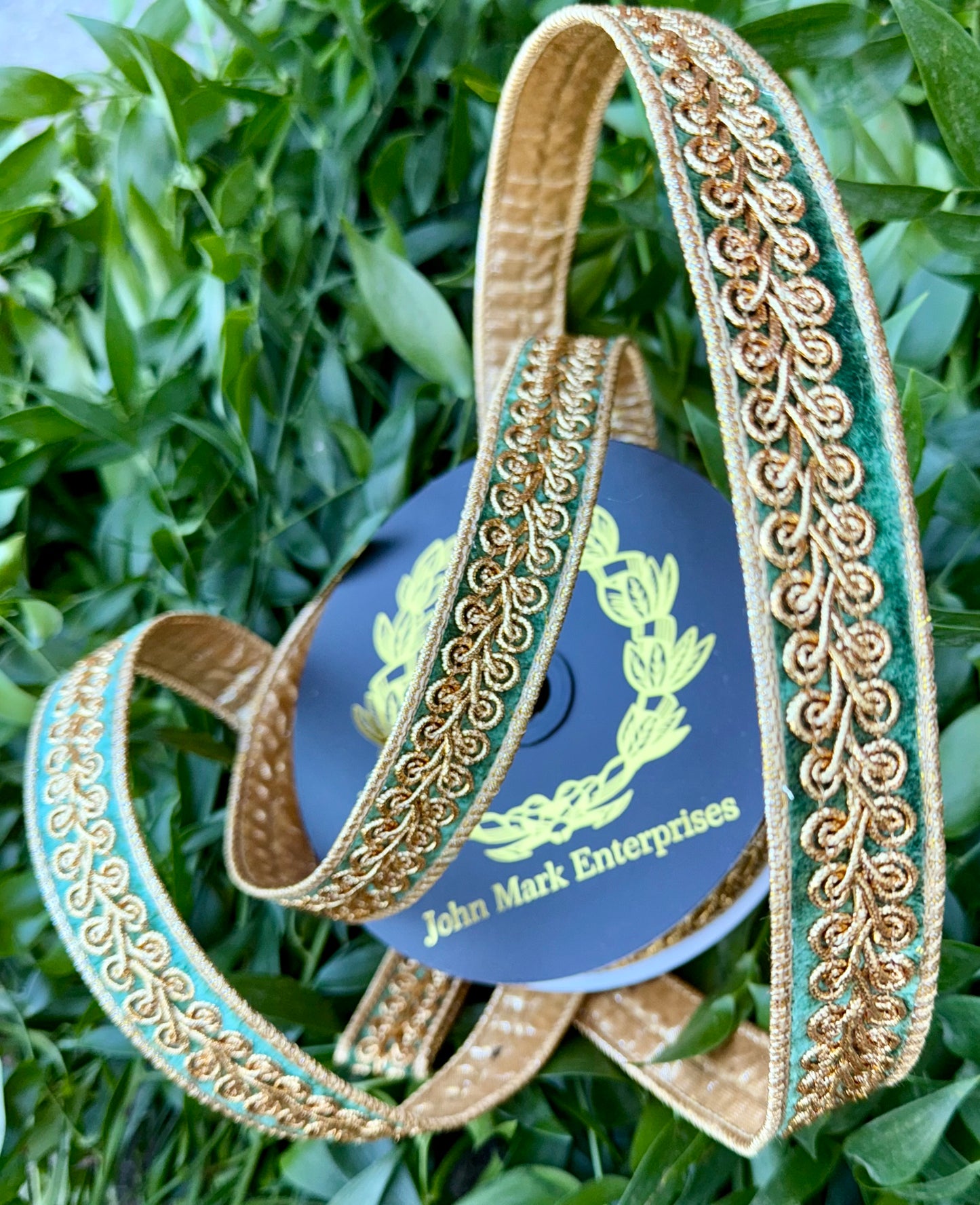 JME heavy wired ribbon. Green velvet with gold embroidered design and back with gold metallic. 1“ x 10 yards.