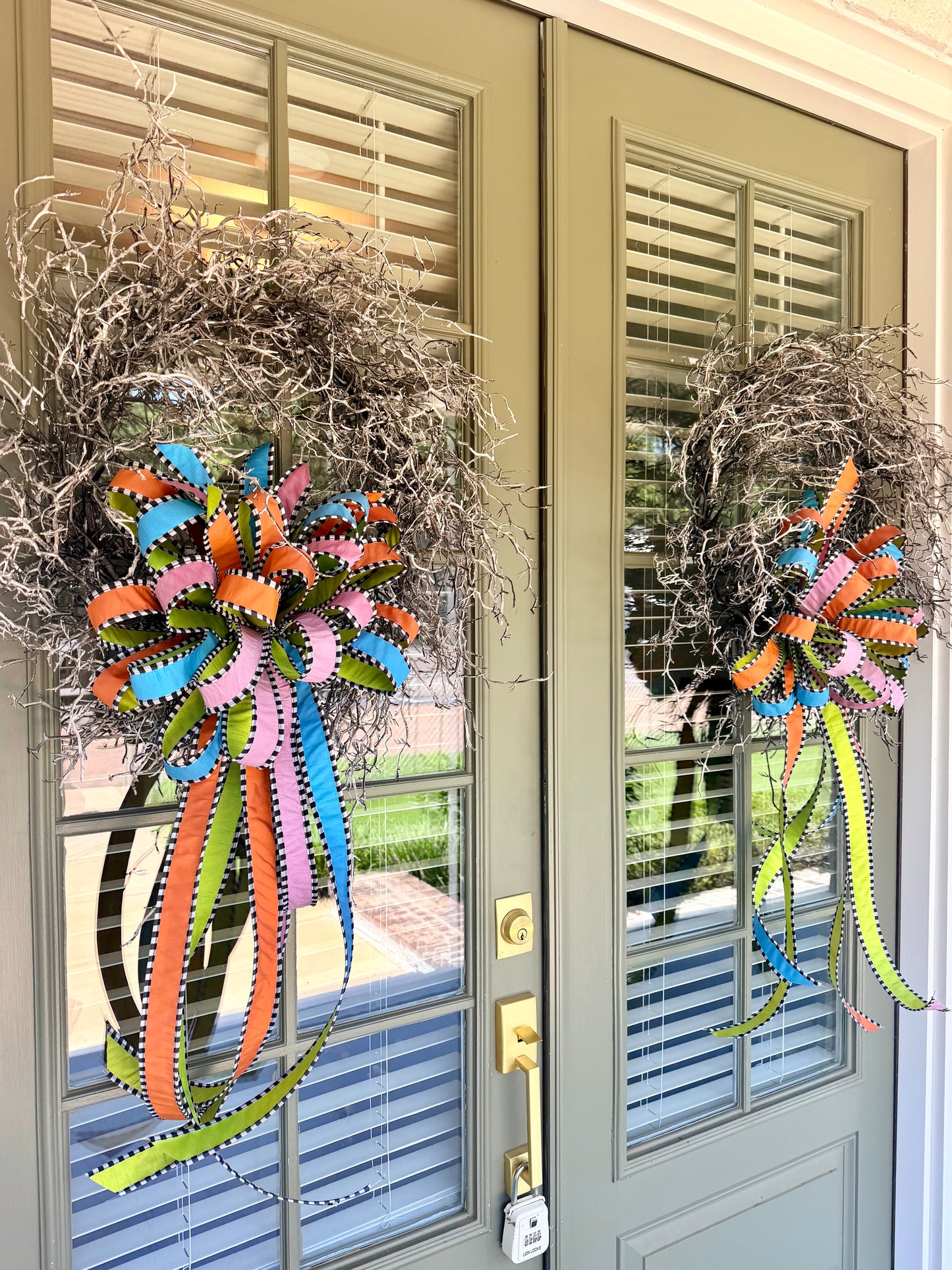 Branchy wreath paired with a hand tied JME bow. Spooky colors for the spooky season! About 28 inches in diameter. * some fluffing may be required upon receiving.