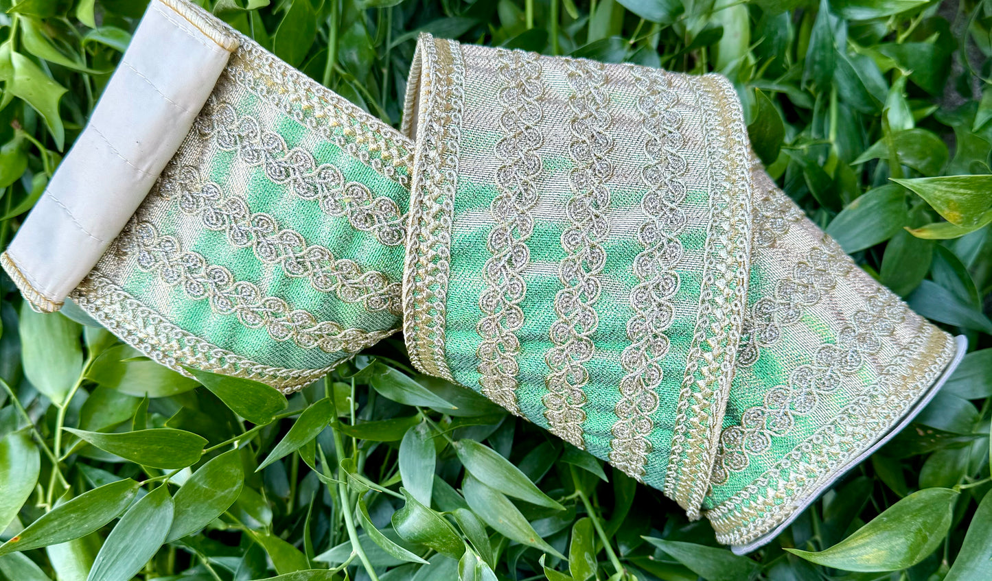 JME heavy wired ribbon. Metallic taffeta with gold bands and trim. Green metallic 5 yards x 4”.