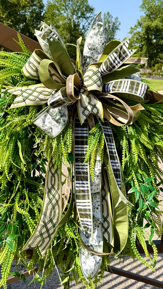 Green/neutral themed bow. Hand tied JME bow. Bow ONLY greenery not included   *some fluffing may be required upon receiving.