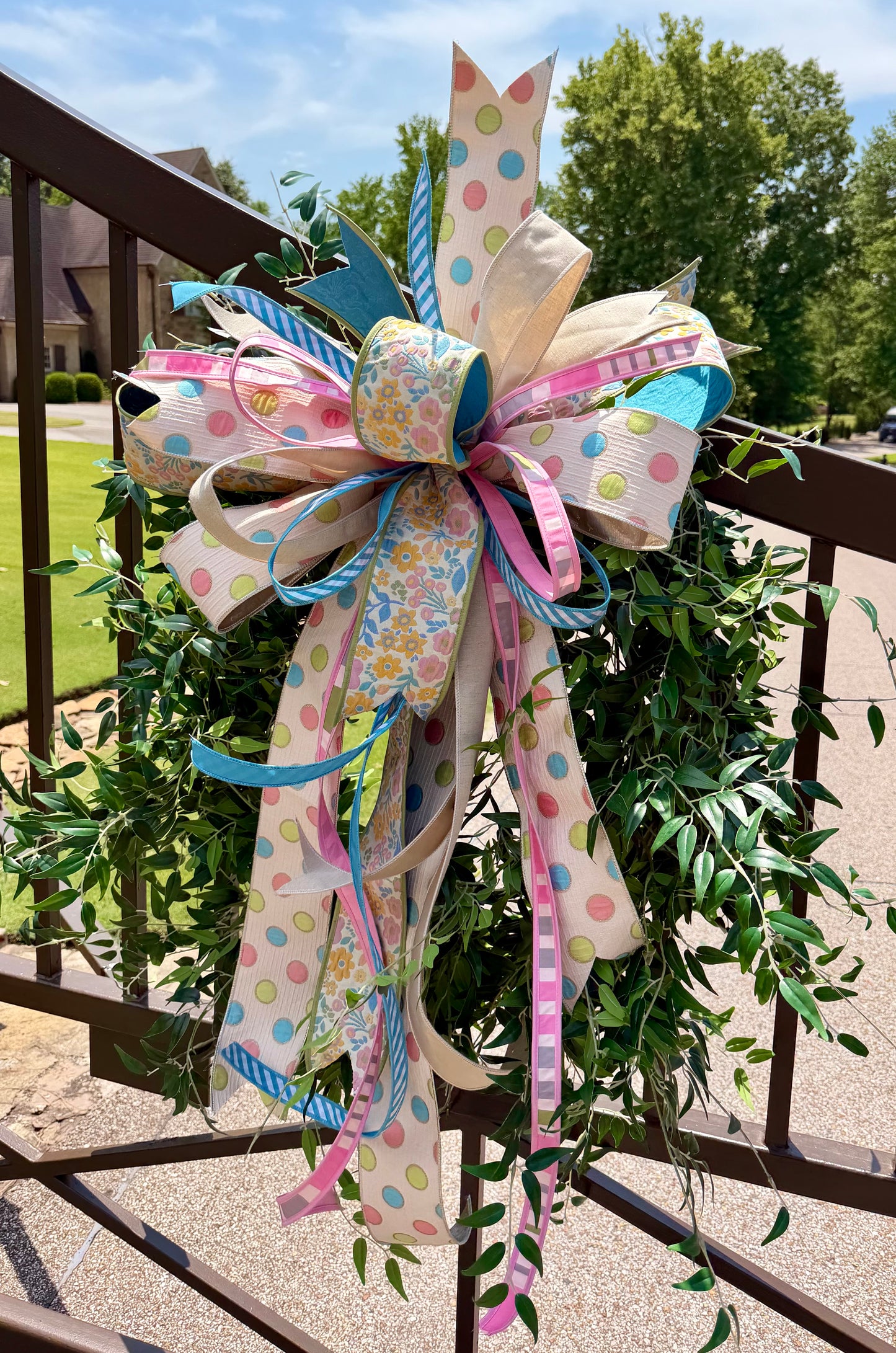 Handtied JME polka dot and floral Summertime bow. Some fluffing may be required upon receiving.