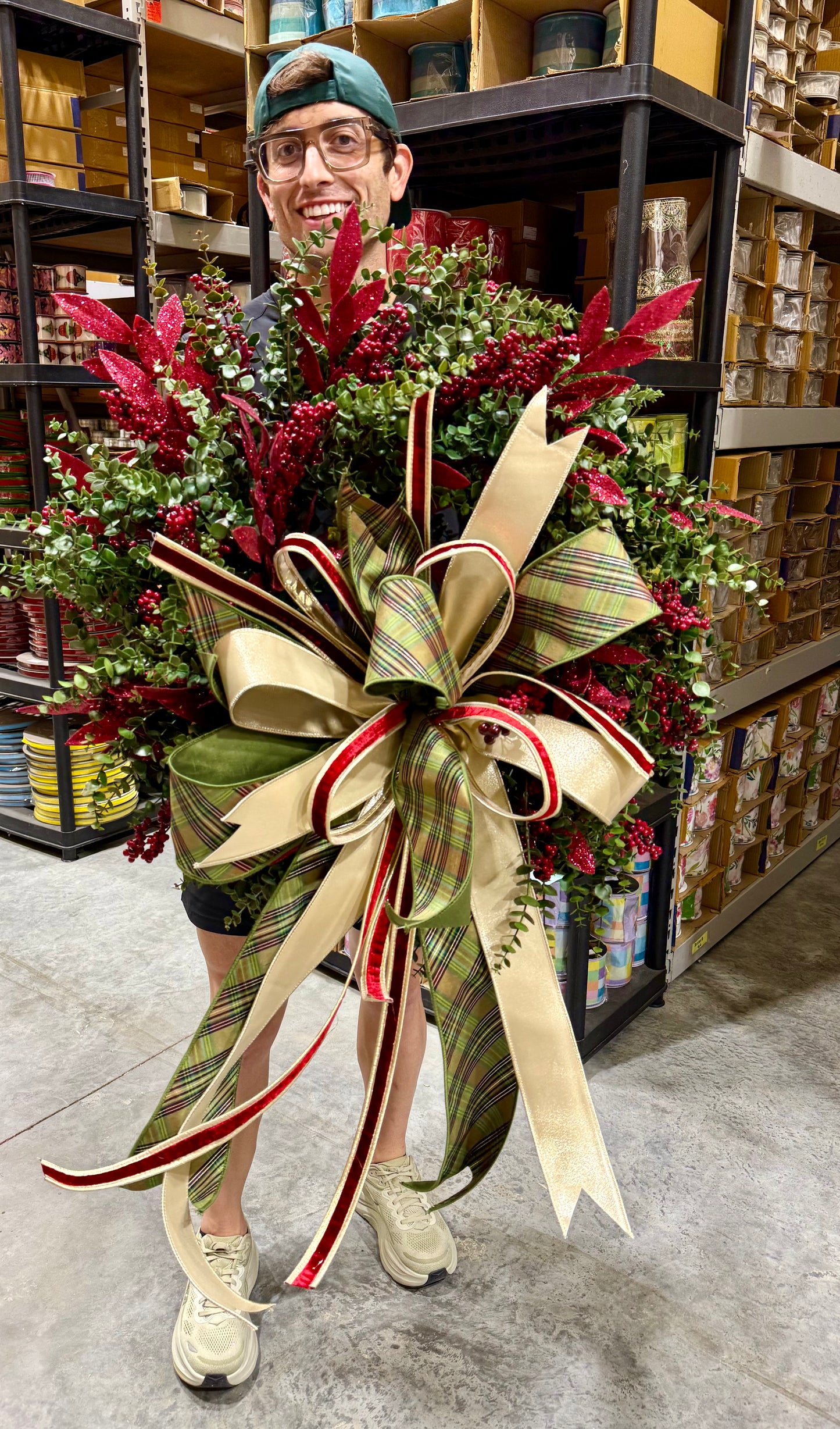 Handsome JME wreath. Made by JME paired with a hand tied bow by JM. About 24 inches wide.