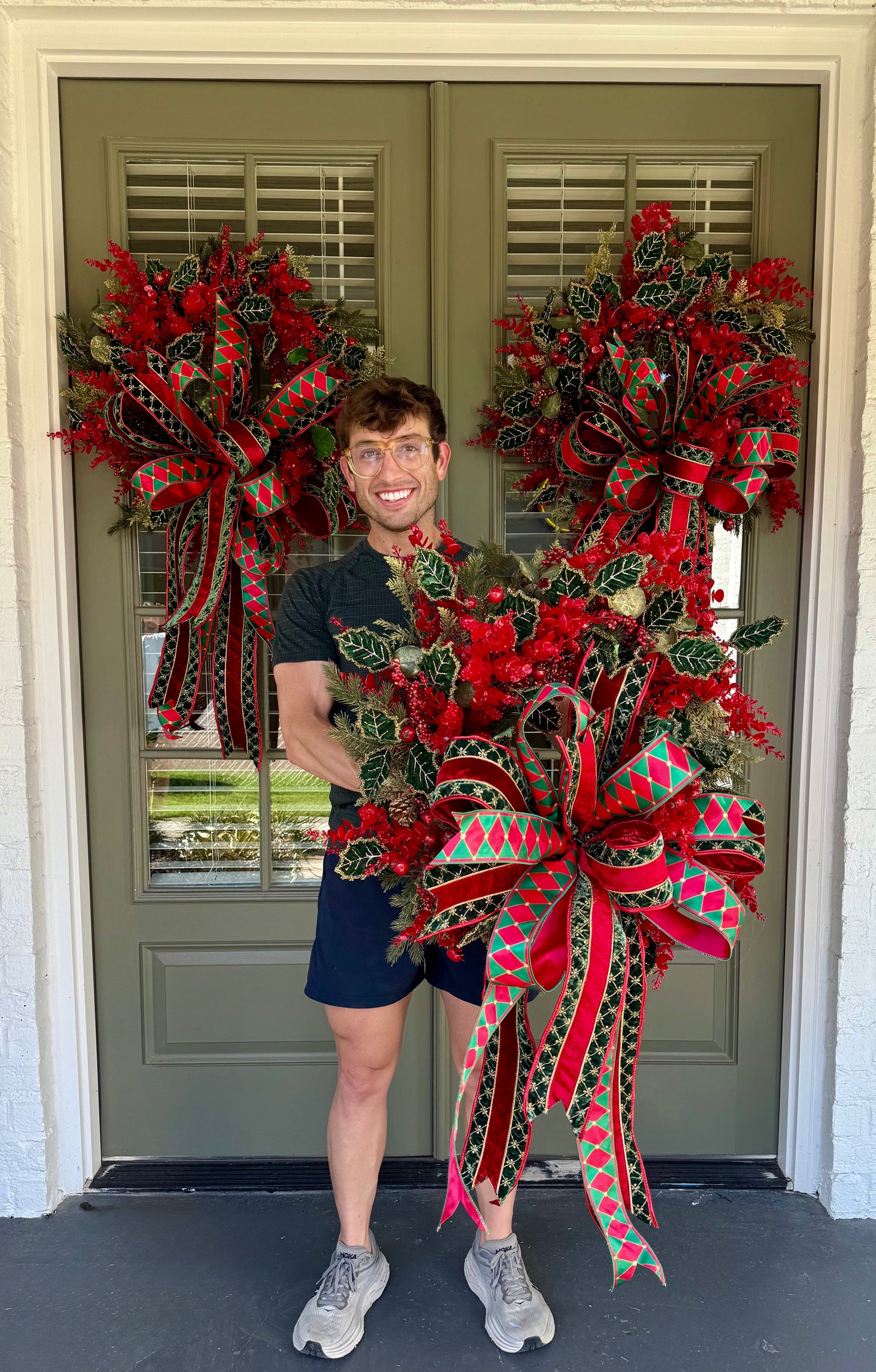 Red and green Traditional wreath. Hand made wreath by JME. About 24 inches wide.