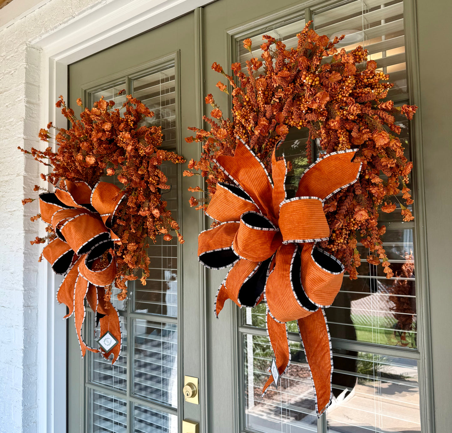 Handmade JME orange berry and paper flower wreath. Paired with a JME hand-tied orange corduroy though. About 24 inches wide. Shipping Monday August 18th.