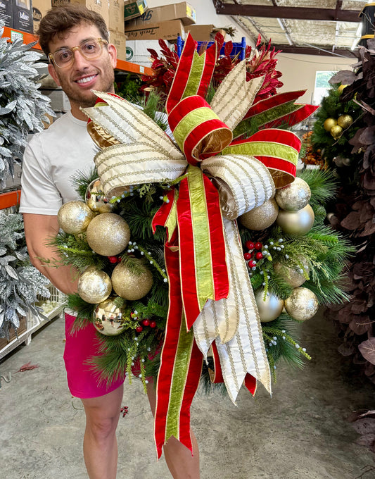 JME faux wreath with gold ornament clusters and a large JME handtied bow. 30 inches wide.