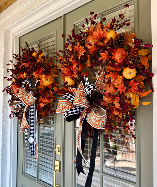 Handmade JME wreath of burgundy and pumpkins. Paired with a JME hand tied bow. About 32 inches wide. SHIPPING Monday August 18th.