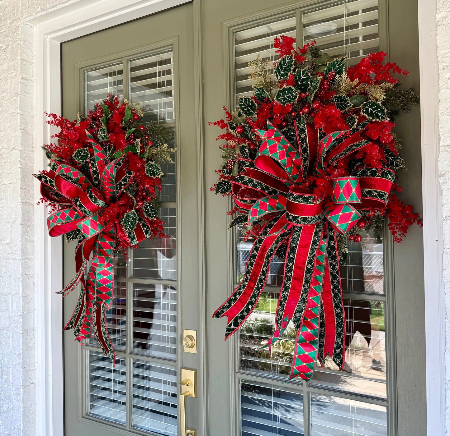 Red and green Traditional wreath. Hand made wreath by JME. About 24 inches wide.