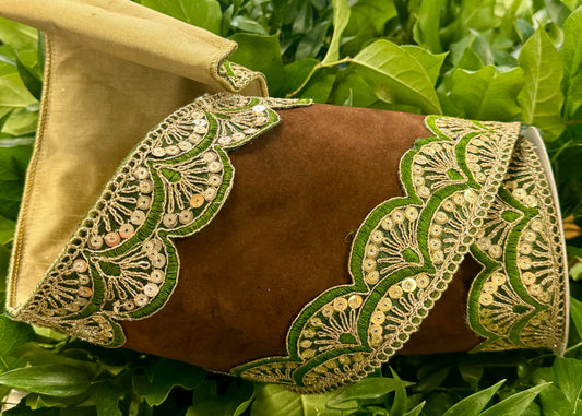 JME heavy wired ribbon. Brown suede with green and sequin embroidered scalloped edge with gold dupion backing. Heavy wired ribbon. 6 inches by 5 yards.
