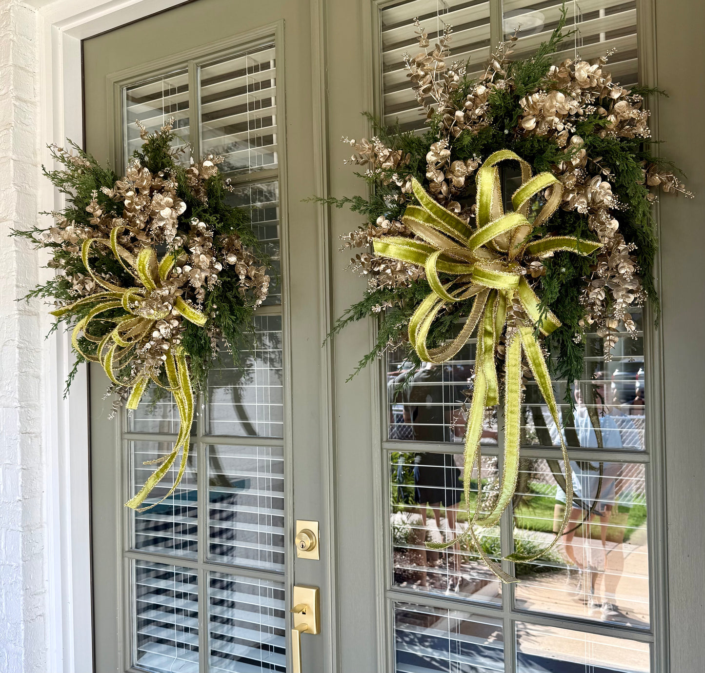 Faux Cedar and champagne eucalyptus wreath. Hand made wreath by JME. About 24 inches wide.