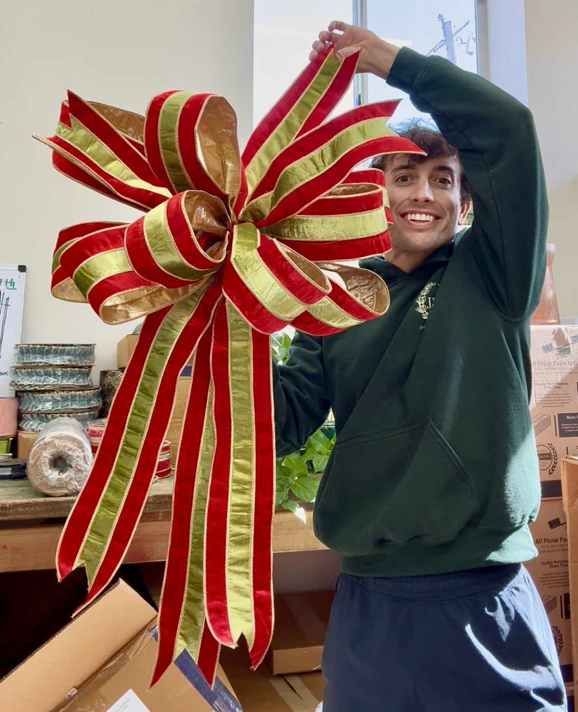 Handtied bow. Red velvet with green velvet overlay. About 10yards worth. About 2 feet long by 3 feet long