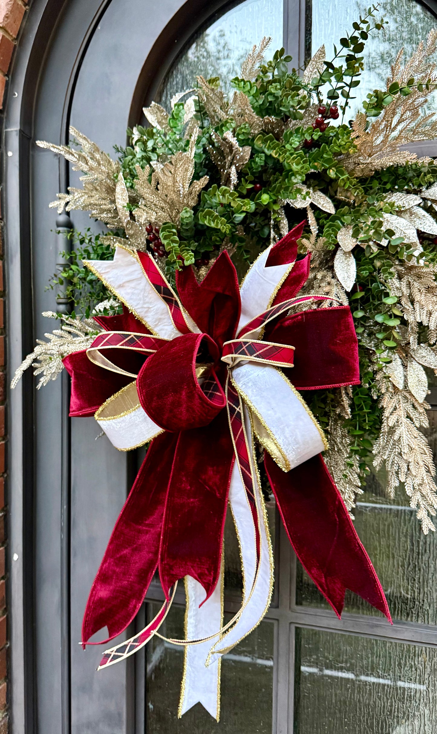 Burgundy and plaid. HANDMADE faux boxwood wreath with champagne touches and a JME hand-tied bow.