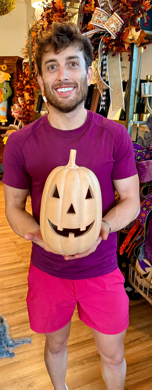 Small ORANGE jack-o’-lantern. With LED light. Runs on batteries. 11 inches.