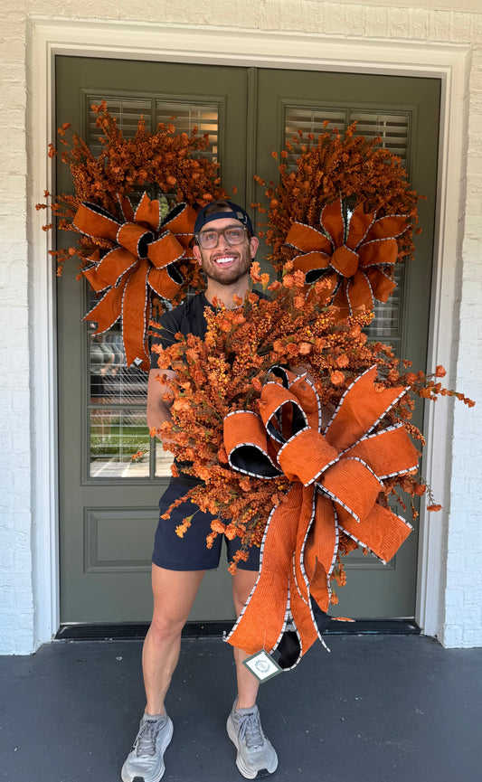 Handmade JME orange berry and paper flower wreath. Paired with a JME hand-tied orange corduroy though. About 24 inches wide. Shipping Monday August 18th.