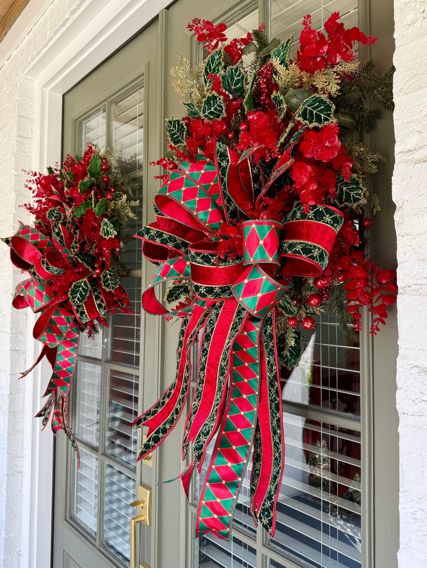 Red and green Traditional wreath. Hand made wreath by JME. About 24 inches wide.