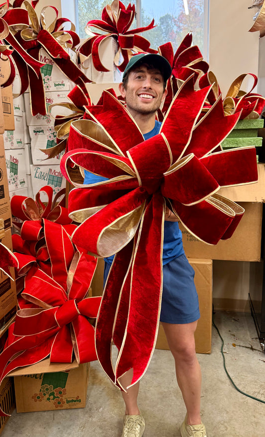 Red velvet with gold trim bow. Made with 10 yards of 4in JME ribbon.
