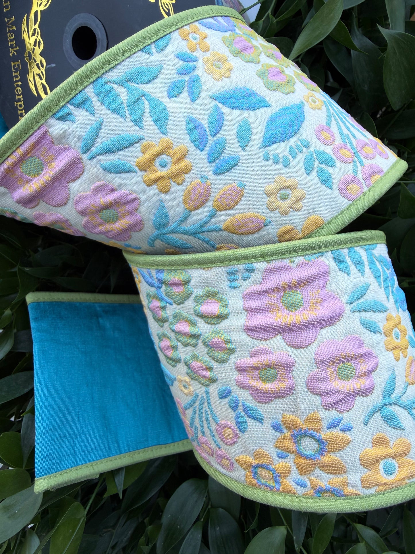 BLOSSOM BRANCH JACQ/DUPION FUSED/PIPING 4"X10YD BLUE HEAVY WIRED RIBBON